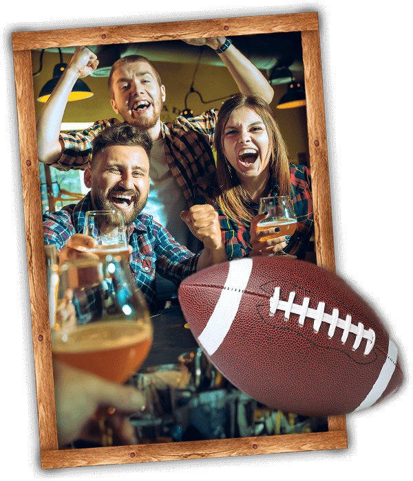 People cheering the game at Johnny's Bar in Wisconsin Rapids Wisconsin. Framed with a football over the frame.